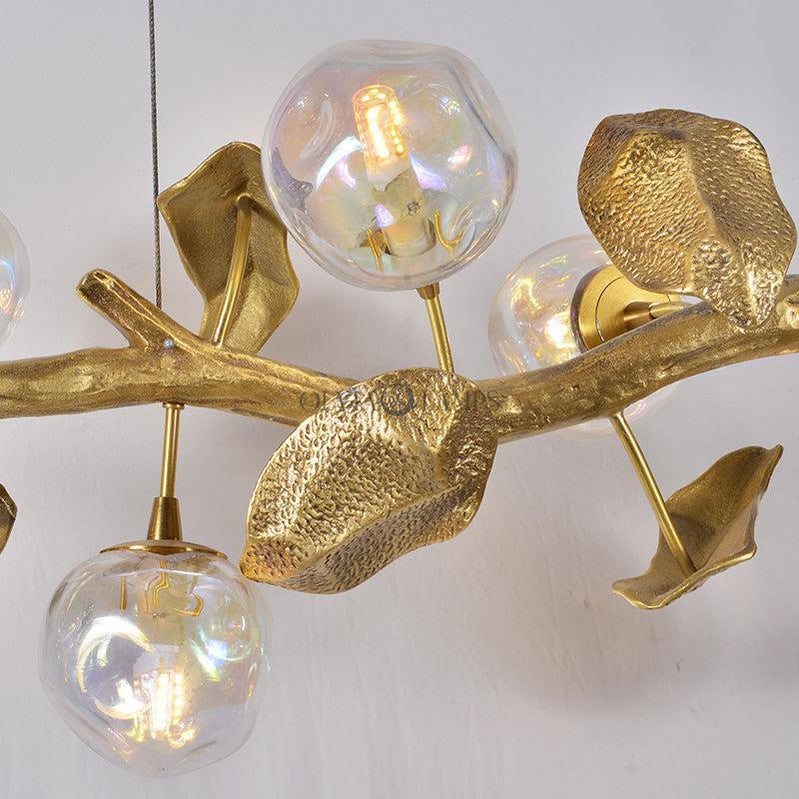 This Organic Glass Bubble Brass Branch Chandelier is artfully designed, it combines with the organic tree branch design, decorated with the metal leaves, creates a fruitfully ideas. it is a new interpretation for the new modern style.