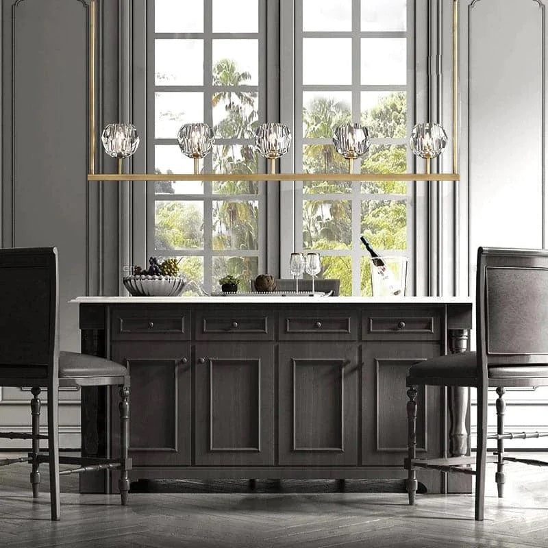 The hexagonal and pentagonal facets on the surface of the K9 glass spheres allow the warm light to reflect beautifully, creating a stunning and inviting ambiance. The overall design of the chandelier highlights its elegance and sophistication, making it a perfect addition to any room that needs a touch of glamour.