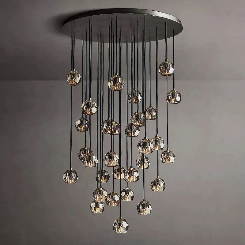 The hexagonal and pentagonal facets on the surface of the K9 glass spheres allow the warm light to reflect beautifully, creating a stunning and inviting ambiance. The overall design of the chandelier highlights its elegance and sophistication, making it a perfect addition to any room that needs a touch of glamour.