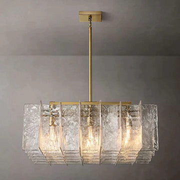 Crafted of solid cast glass, our Lattice collection's interlocking planes recall the geometric precision of the mid-century International Style. A study in repetition and rhythm, the linear form employs open space to lend a weightless feel. Gently rounded corners on the fluid, rippled panes subtly soften the outline, while diffused light glows from within.